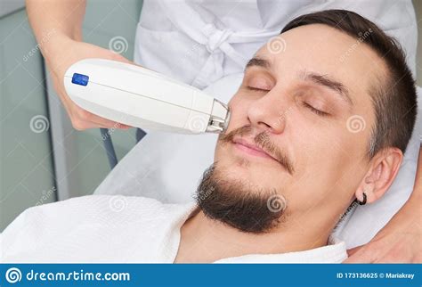 Man Having Laser Treatment At Beauty Clinic Stock Image Image Of
