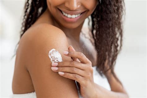 Closeup Shot Of Young Black Female Rubbing Moisturising Lotion To Skin Stock Image Image Of