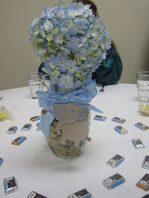 Rachel used gray and light blue in the nursery with some elephant decor and i wanted to follow along in our party. Centerpieces,vases filled with peanuts,blue hydranges and ...