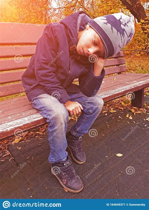 Sad Boy Sitting On Bench Alone Outdoor Stock Image Image Of Outdoor