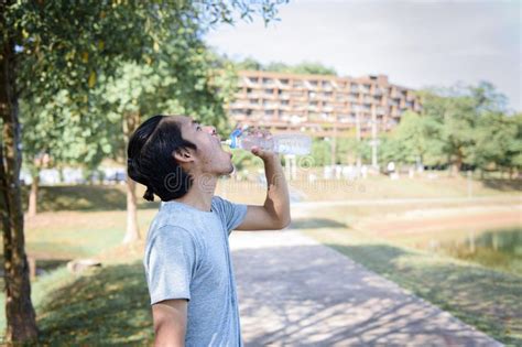 Young Man Drinking Water Before Workout Exercising Stock Photo Image