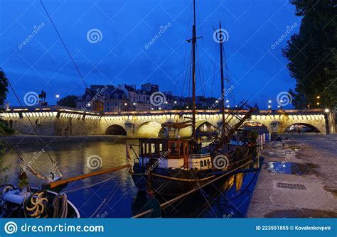 Cityscape Of Downtown With Pont Neuf Bridge And River Seine At Night