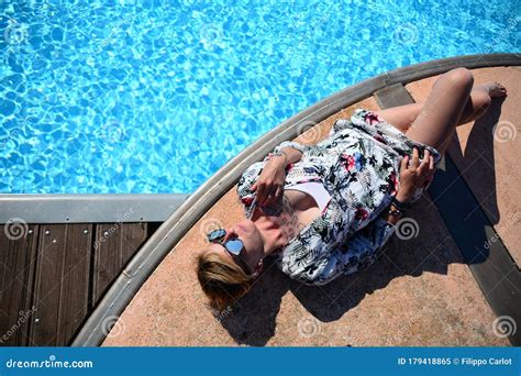 Blonde Girl Lying On The Swimming Pool 6 Stock Image Image Of Pleasure Skin 179418865