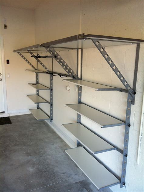 These divots will fit over the metal pins used to adjust the positions of the shelves. Treasure Coast Garage Shelving Ideas Gallery | Garage Gem
