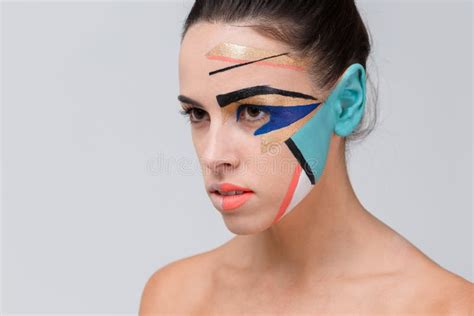 A Girl With Creative Geometric Make Up On Her Face Stock Image