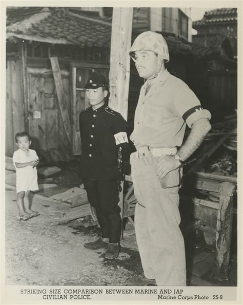 Us Marine Standing Next To A Japanese Police Officer Japan 1945 The Digital Collections Of