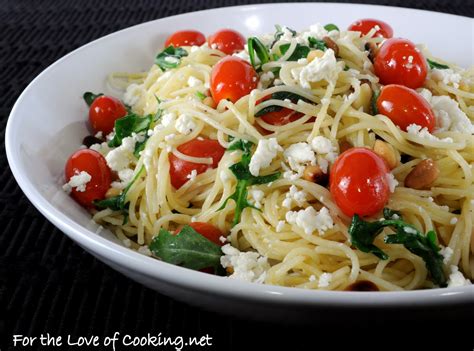 This angel hair pasta is made with cherry tomatoes, garlic, and olive oil. Angel Hair Pasta with Arugula, Feta Cheese, Tomatoes, and ...