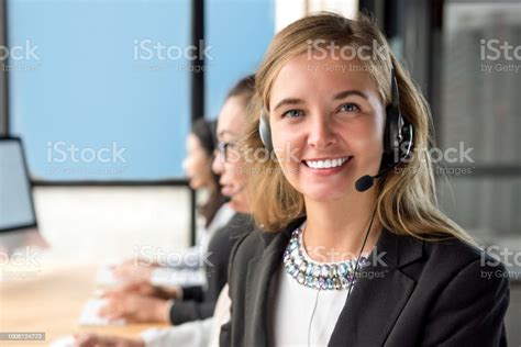 Beautiful Woman Customer Service Agent Working In Call Center With Her