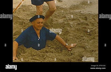 Vintage Mm Film France Happy Family At Beach Man Buried In Sand Stock Video Footage Alamy