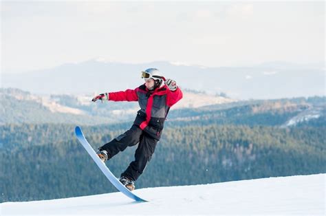 Premium Photo Male Boarder On His Snowboard At Winer Resort
