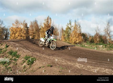 Motocross Enduro Rider In Action Accelerating The Motorbike After The