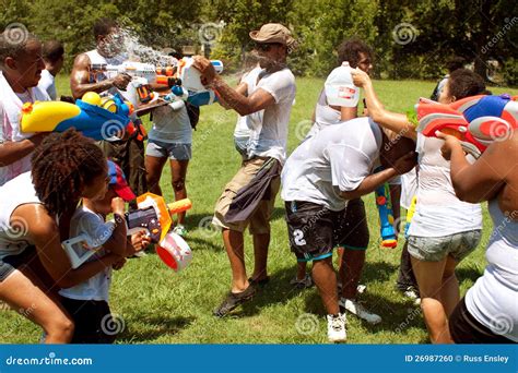 People Drench One Another In Group Water Gun Fight Editorial Image