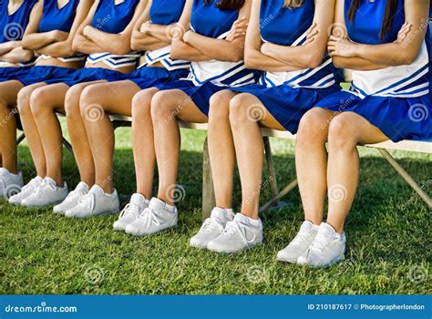 Photo Of Cheerleaders Sitting On Bench Stock Image Image Of Blue Cheerleading 210187617