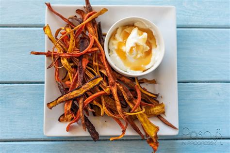 Thinly slice the carrots into ribbons using a mandolin. This Baked Carrot Chips Recipe is Easy and Yummy | Posh in ...