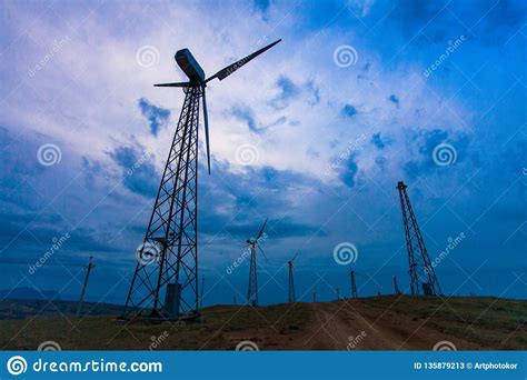 Wind Turbines On Dark Sky Background Alternative Energy Source Stock