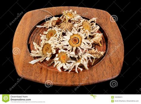 Dried fine chamomile flowers to scent your whole house. Plate With Dried Chamomile Flowers Stock Photo - Image of ...
