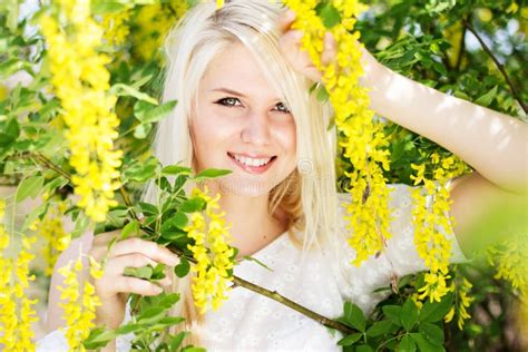 Beautiful Blonde Girl With Yellow Flowers Stock Photo Image Of