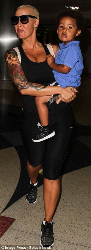 amber rose showers son sebastian with smooches and as they walk through lax daily mail online