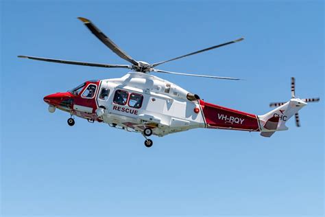 Red And White Helicopter Flying In The Sky · Free Stock Photo