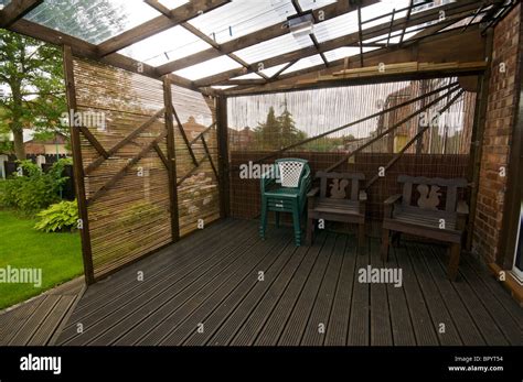 Home Built Patio Decking With Corrugated Plastic Roofing And Movable