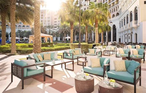 the ritz carlton abu dhabi grand canal hotel abu dhabi uae pool deck outdoor lounge travoh