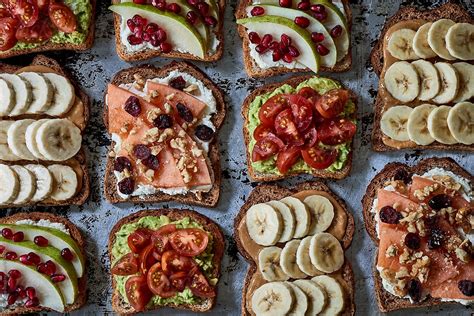 Assortment Of Healthy Breakfast Toasts On Tray For Wellness By Stocksy Contributor Trent Lanz