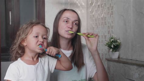 Mom Cute Little Daughter Is Brushing Teeth Stock Footage Sbv 335175211