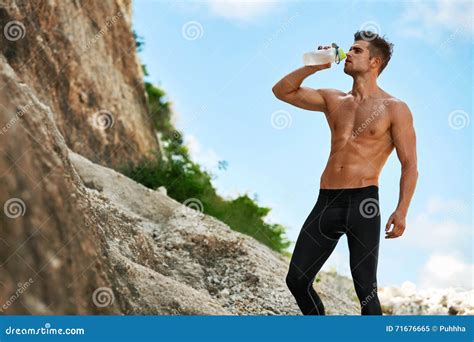 Hot Thirsty Man Drinking Water Drink After Running Outdoors Sport