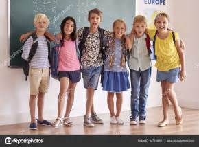 Happy Classmates Standing Embraced Stock Photo By ©gpointstudio 147414655