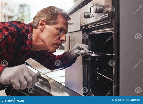 He Knows How To Solve This Problem Close Up Of Repairman Examining