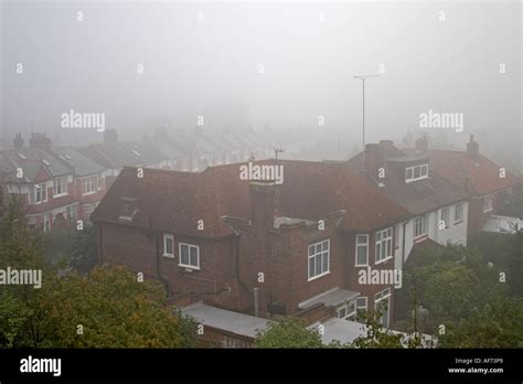 Misty Foggy Day Over Suburban Rooftops Of Houses In Suburbs Of Muswell