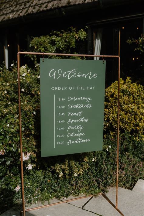 Green Hand Painted Wedding Weclome Sign With Combined Order Of The Day