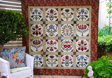 This 13 block sampler quilt is set on point and bordered with an ornate design. William Morris in Quilting: Quilt Gallery and Patterns