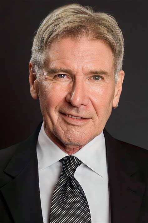 An Older Man In A Suit And Tie Posing For A Photo With His Eyes Wide Open