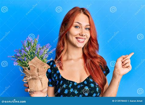Young Beautiful Redhead Woman Holding Lavender Pot Smiling Happy