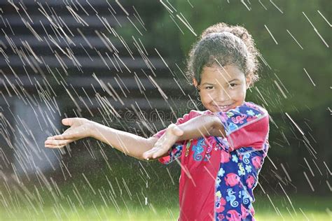 Young Girl Playing In The Rain Stock Photo Image Of Girl Sprinkles