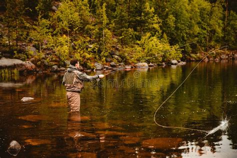 Fisherman Using Rod Fly Fishing In Mountain River Stock Image Image