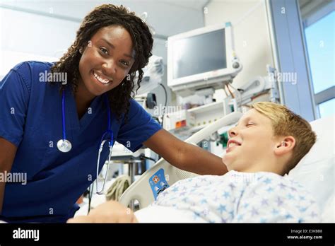 Boy Talking To Female Nurse In Emergency Room Stock Photo Alamy