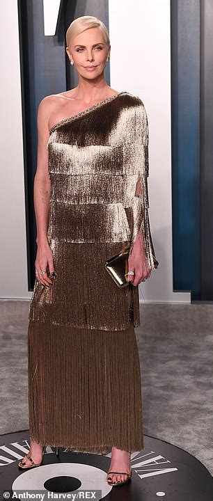 Charlize Theron Changes Into Shimmering Gold Gown At Vanity Fairs