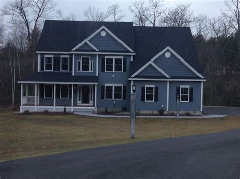 Go from stale to stunning with one bold stroke. Blue siding, white trim; also like the accent shingles ...