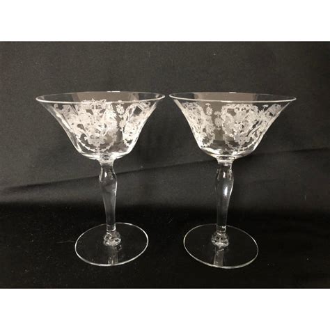 These 14 vintage crystal champagne glasses have etched floral patterns and horizontal stripes, as well as elegant faceted style stems. Vintage Elegant Etched Champagne Glasses S/ 2 | Chairish