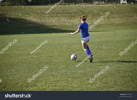 Girl Dribbling A Soccer Ball Before A Match Stock Photo 6557782