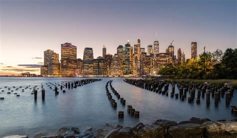Beautiful Sunset And Lower Manhattan Skyline With East River And New