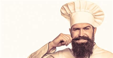 Premium Photo Beard Man And Moustache Wearing Bib Apron Bearded Chef Cooks Or Baker Bearded