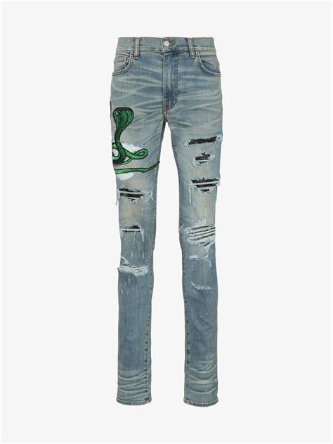 Amiri Thrasher Skinny Fit Appliquéd Distressed Stretch Denim Jeans In