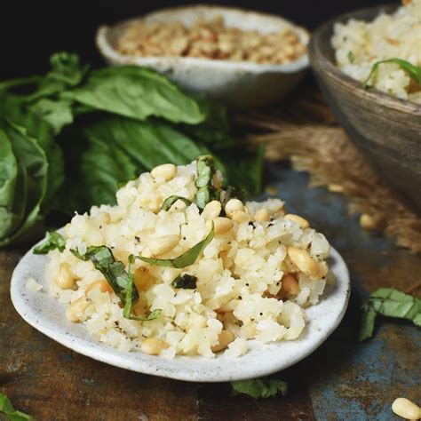 Cauliflower Rice Pilaf Recipe Served On A Plate With Nuts And Basil