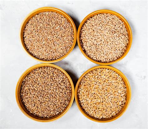 Various Hulled Wheat Grains In Round Ceramic Bowls Stock Image Image