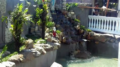 For those installations, you simply move the upper most rock toward the pool water an additional foot so that water flows completely into the pool. grotto with crown type gazebo - YouTube