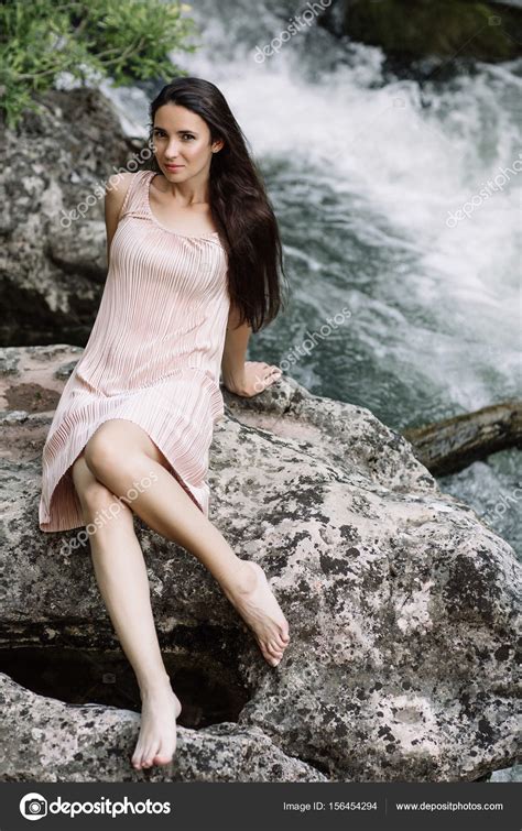 Beautiful Brunette Sitting On A Rock In The Middle Of The River Water Waterfall Beautiful