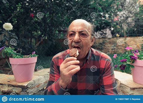 Close Up Portrait Of Senior Man Eating Ice Cream Stock Image Image Of